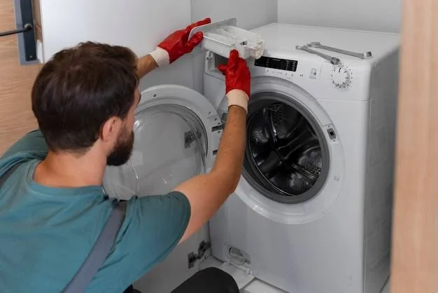 Repair professional opening the top panel of a washing machine